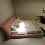 Soft Pink Upholstered Bed with Oversized Cushion Headboard & Rounded Base